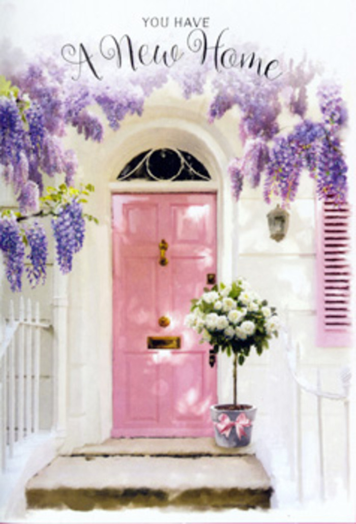The photograph shows a dreamy entrance that looks as if it could be found on a calm residential lane just off Elephant and Castle, where life slows for a moment and small details matter. At the centre stands a pale rose-pink front door, its surface smooth and inviting, framed by a simple yet elegant border of white masonry. The gentle hue hints at warmth and kindness, like the smile of someone greeting you at the threshold. Above the door and trailing along the wall, wisteria unfurls in generous swathes of lavender, lilac, and muted purple blooms. The vines twist organically, with drooping racemes that dangle in soft curtains, each composed of many delicate, pea-like flowers that seem to shimmer in the light. A single pastel shutter, painted in a tone that sits between blush and dusty pink, rests slightly ajar, adding charm and balance to the façade. At ground level, placed squarely on the doorstep, is a grey tin bucket repurposed as a floral container, brimming with creamy white roses. The roses are luxuriously full, their petal edges slightly ruffled, suggesting both softness and abundance. Threads of fresh green foliage slip between the blooms, giving the composition texture and a hint of movement, reminiscent of greenery peeking through the urban architecture of Elephant and Castle's side streets. Around the base of the bucket, a satin pink ribbon has been tied with care, its long tails resting on the step like a quiet promise. The lighting feels like late afternoon, gentle and golden, casting subtle shadows that highlight the curvature of petals and the grain of the door. Together, these elements create a scene that radiates optimism, tenderness, and the intimate joy of stepping over the threshold of a new home, making it an evocative visual for housewarming flowers delivered in and around Elephant and Castle.