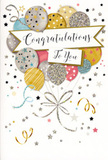 The card shown in the image embodies a joyful yet polished celebration, as if someone has captured the mood of a party near Elephant and Castle and translated it into ink, foil, and glitter. Dominating the front is a bouquet-like arrangement of illustrated balloons clustered together in the centre, their rounded forms overlapping slightly. The colours are soft and festive-shades of warm gold and silver, champagne cream, gentle sky blue, blush pink, and quiet grey-each balloon finished with its own decorative detail such as tiny metallic stars, delicate stripes, or sparkling, glitter-like speckles. These details give the impression of gentle movement and texture, like light catching different petals in one of our hand-tied congratulatory arrangements. Slender ribbons in shimmering gold and silver stream downward from the balloons, curling and turning in relaxed spirals before gathering into a single, ornamental bundle at the bottom of the design. Floating across the centre is an elegant banner bearing the words 'Congratulations To You' in refined, sweeping calligraphy that conveys warmth and sincerity. The background is sprinkled with scattered stars and swirling confetti shapes, all rendered in metallic tones that suggest a subtle, magical shimmer-like party lights glowing through windows along the nearby streets on a celebratory evening. The overall feeling is one of lightness, success, and pride, perfectly suited to accompany a bouquet for a graduation, promotion, or new beginning in the Elephant and Castle area, where a simple card and flowers can turn a passing achievement into a cherished memory.